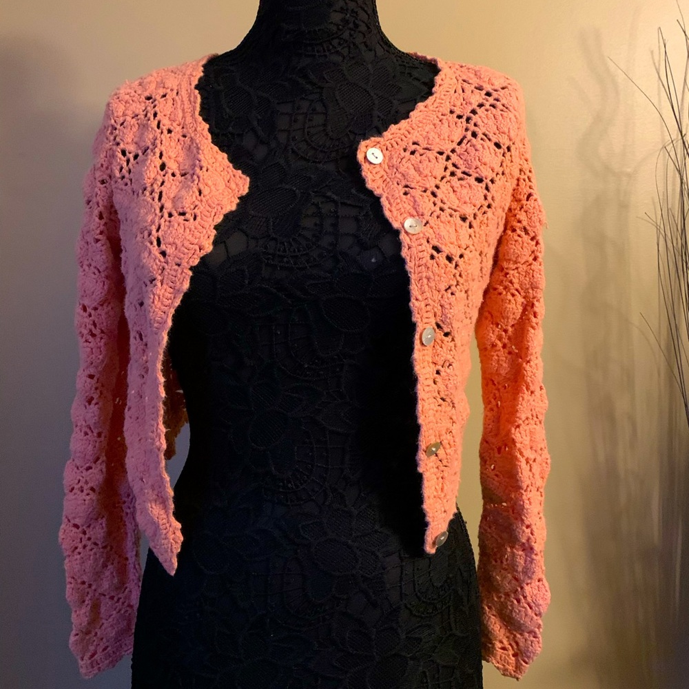 Crochet cardigan with abalone shell buttons
